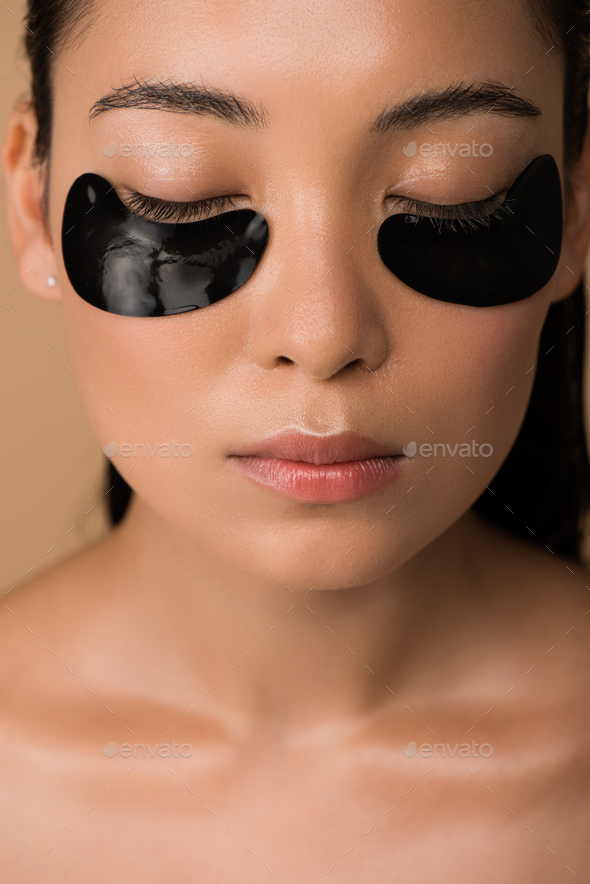 Beautiful Naked Asian Girl With Black Hydrogel Eye Patches Under Closed