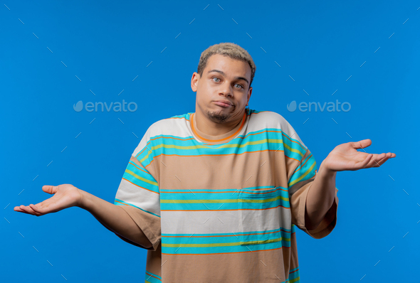 Confused man, shoulders up - can't help, makes gesture of I dont know. Difficult question, guilty - Stock Photo - Images