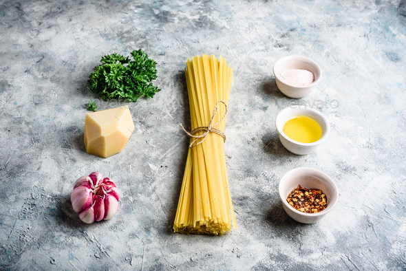 Raw ingredients for linguine with olive oil and garlic - Stock Photo - Images