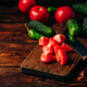 Sliced tomatoes on cutting board and cucumbers with chili pepper - PhotoDune Item for Sale