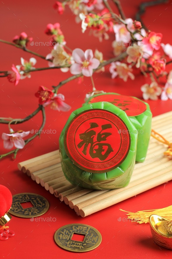 Green Nian Gao Pandan or glutinous rice cake with Good Luck in Chinese