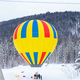 bright yellow hot air balloon in winter mountains, tourist attraction - PhotoDune Item for Sale