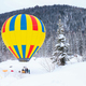 bright yellow hot air balloon in the snowy mountains - PhotoDune Item for Sale