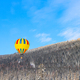 bright hot air balloon on the background of winter mountains - PhotoDune Item for Sale