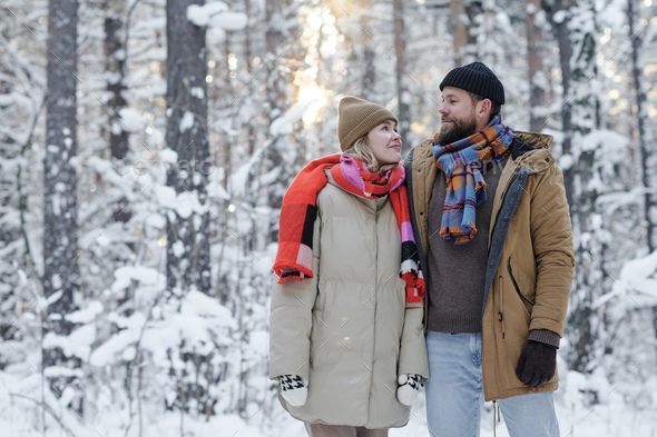 Young couple enjoying their winter walk - Stock Photo - Images