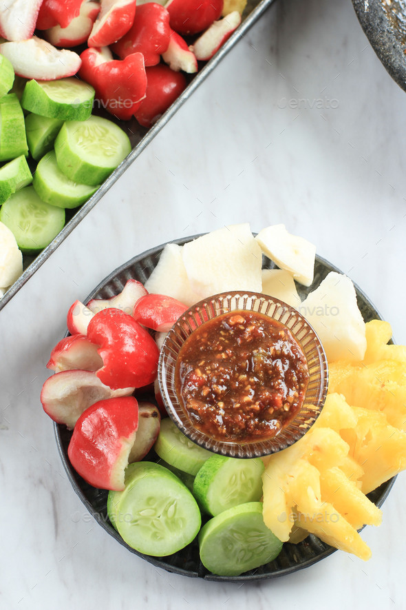 Rujak Buah Or Sliced Indonesian Fruit Salad Served With Spicy Brown