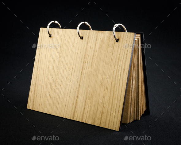 Wooden notebook on a dark background. - Stock Photo - Images