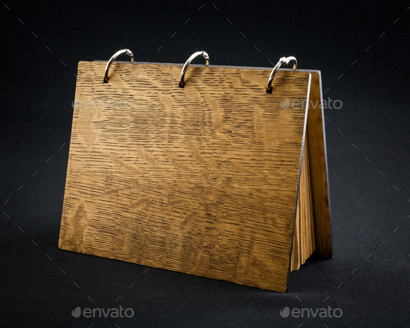 Wooden notebook on a dark background. - Stock Photo - Images