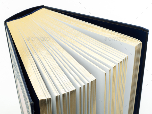 Thick book with gilded pages on white background - Stock Photo - Images