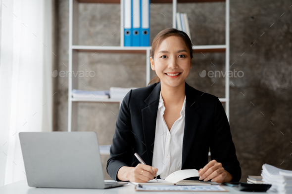A businesswoman is checking company financial documents.