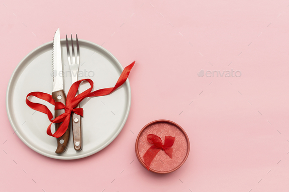 Valentine\'s Day, Womens day table serving with cutlery, plate, gift box. Romantic dinner, love