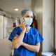 Doctor talking to the mobile phone in a hospital - PhotoDune Item for Sale