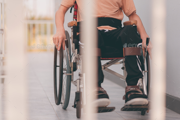 Manual wheelchair use training for the person with disability. - Stock Photo - Images