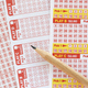 Flat lay of lottery ticket sheets with numbers and pencil - lottery forms slips for choosing numbers - PhotoDune Item for Sale