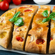 Homemade Italian Focaccia with basil and tomatoes. Italian food. Italian bread - PhotoDune Item for Sale