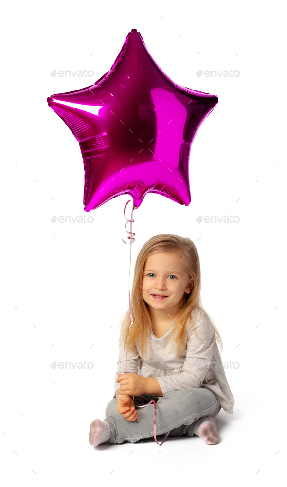 Cute little blonde girl with purple star shaped baloon isolated on white background - Stock Photo - Images