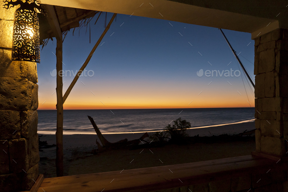 View of the sunset over the sea at a beach resort. - Stock Photo - Images