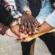 Diversity and teamwork as a group of diverse people joining hands - PhotoDune Item for Sale