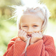 Portrait of sweet little blonde girl playing in sun outdoors. - PhotoDune Item for Sale