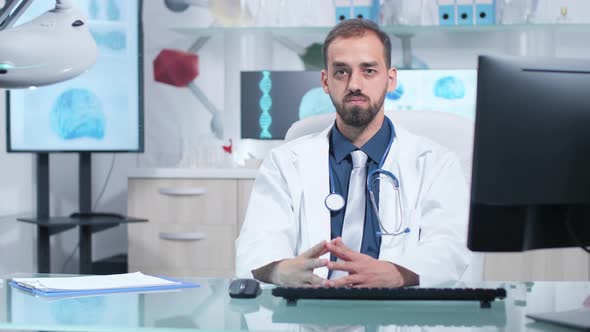 Portrait of Serious Doctor Looking at the Camera alt