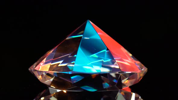 Diamond Glows with Highlights Because It Is Multifaceted and Transparent. Black Background alt