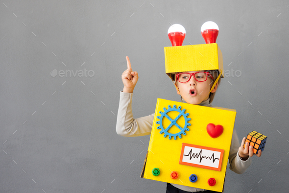 Happy child wearing a robot - Stock Photo - Images