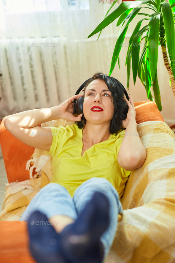 Female woman in headphones with eyes closed listening to music, podcast - Stock Photo - Images
