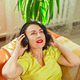 Female woman in headphones with eyes closed listening to music, podcast - PhotoDune Item for Sale