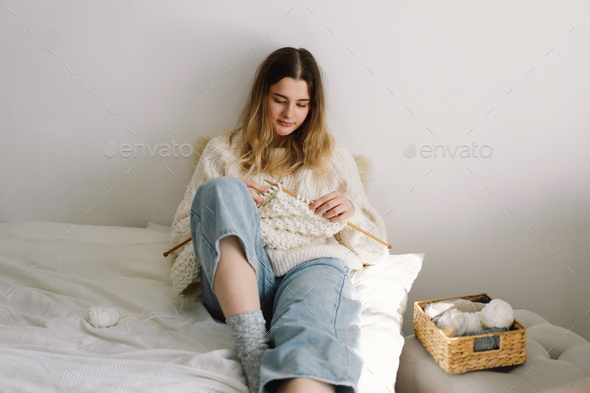 Teengirl knitting at home. Handmade and Hobby. - Stock Photo - Images