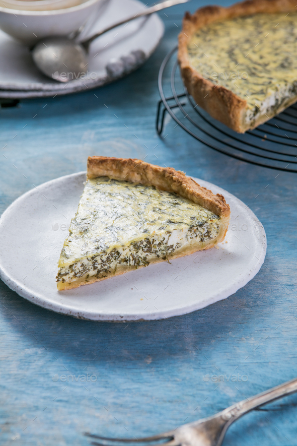 Quiche with spinach traditional dish of french cuisine. Spinach tart Stock Photo by sokorspace