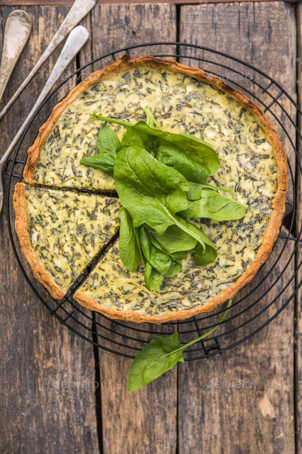 Quiche with spinach traditional dish of french cuisine. Spinach tart Stock Photo by sokorspace