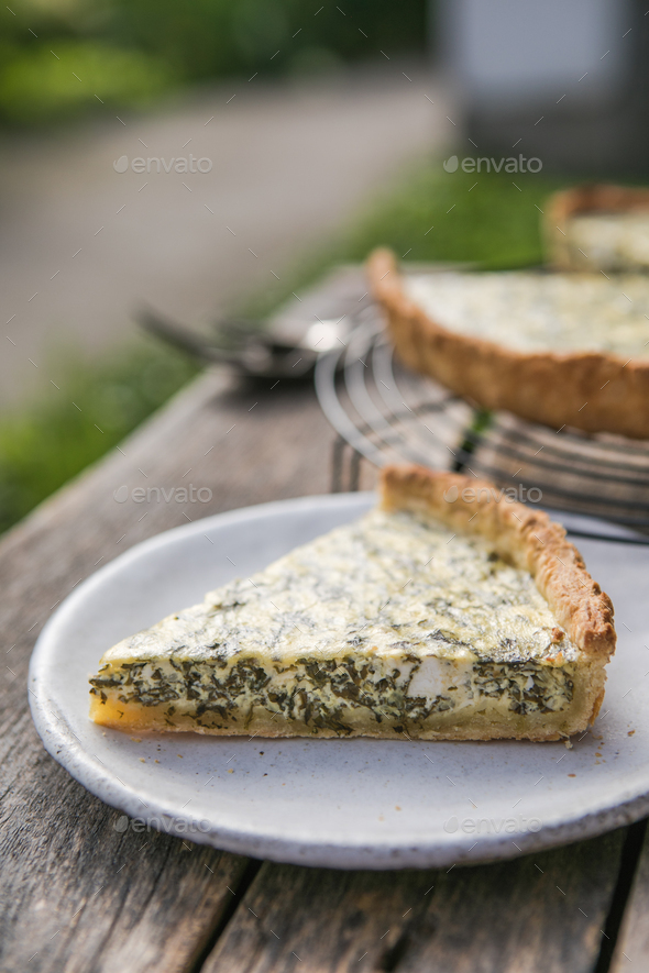 Quiche with spinach traditional dish of french cuisine. Spinach tart Stock Photo by sokorspace
