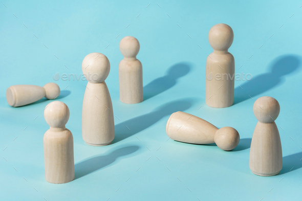 People standing together close to people feeling bad. Wooden figurines. Medical assistance concept