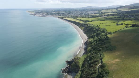 Stunning Landscape Of Green Coastal Mountains With A View Of Greystones South Beach And Town In Wick alt