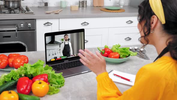 Smiling Woman in Home Kitchen Study Online Video Call Laptop Listen Chef Teacher alt