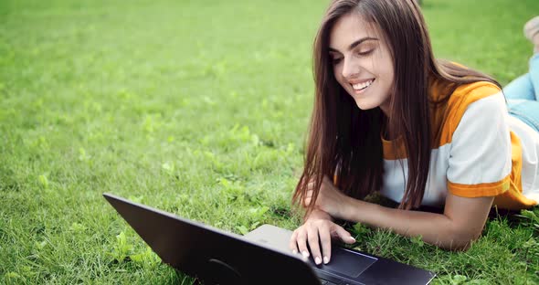 Woman with Laptop Working Outdoors