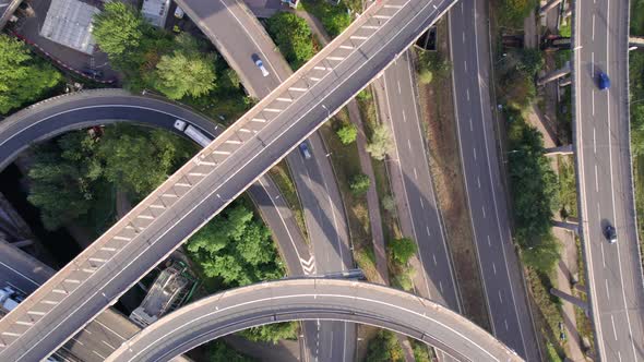 Vehicles Driving on a Mixing Interchange Bird's Eye Aerial View alt