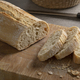 Traditional Italian fresh baked ciabatta bread and slices on a cutting board - PhotoDune Item for Sale