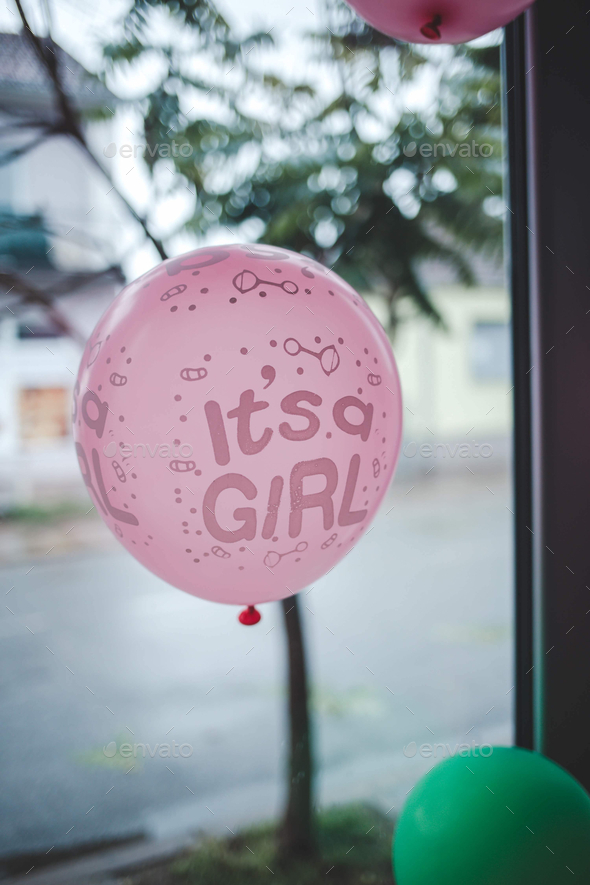 Selective focus shot of a pink balloon in a gender revealing party