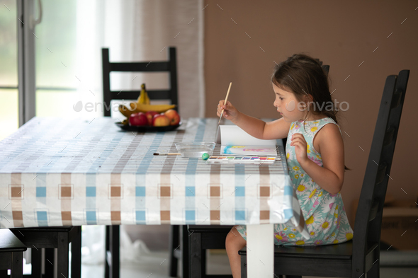 little girl draws in the album - Stock Photo - Images