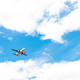 landing plane on blue sky with clouds - PhotoDune Item for Sale