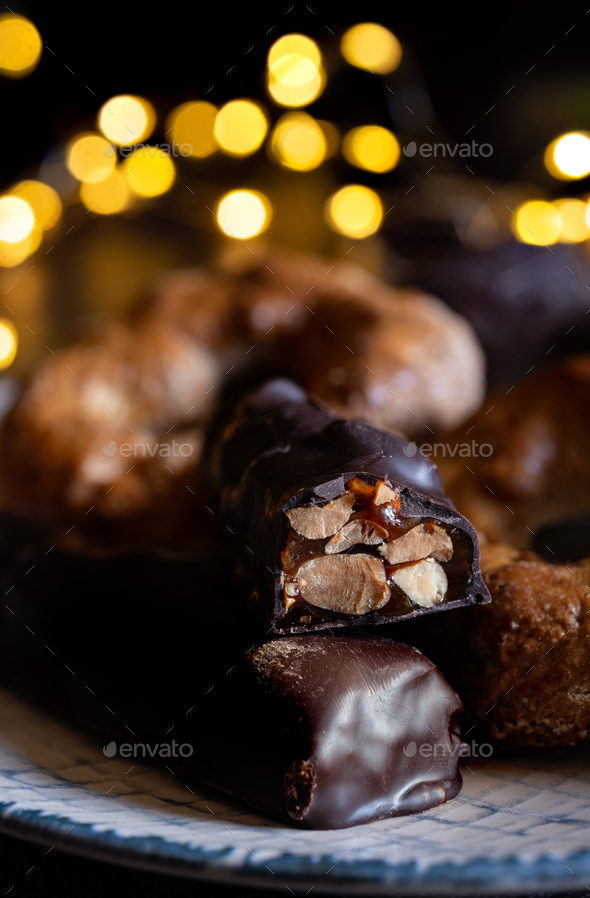 crunchy nougats with honey and covered in chocolate - Stock Photo - Images