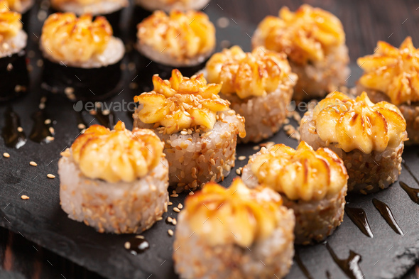 Japanese salmon sushi with spicy mayonnaise - Sushi menu norimaki and uramaki. Asian cuisine concept - Stock Photo - Images