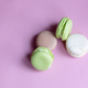 different macaroons on a pink background, copy space - PhotoDune Item for Sale