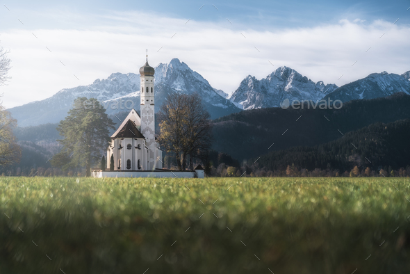St Coloman Church with Alps Tannheim Mountains on background - Schwangau, Bavaria - Stock Photo - Images
