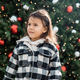 Adorable toddler girl standing next to Christmas tree outdoor, season holiday and childhood concept - PhotoDune Item for Sale