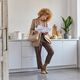 Photo of serious attractive busy female freelancer looks through paper documents makes phone call - PhotoDune Item for Sale