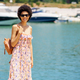 Cheerful African American female near sea in port - PhotoDune Item for Sale