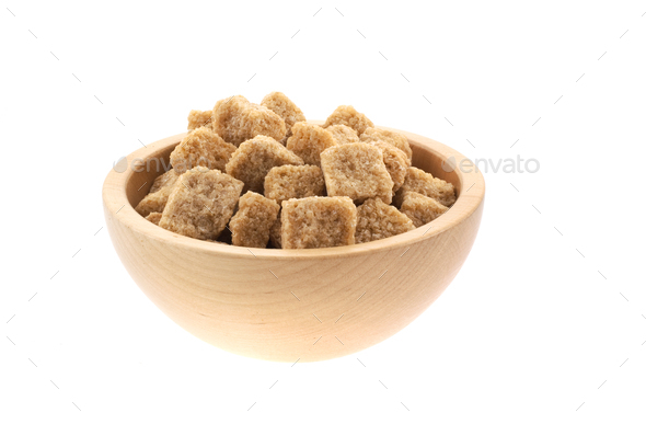 brown sugar cubes in a wood bowl - Stock Photo - Images