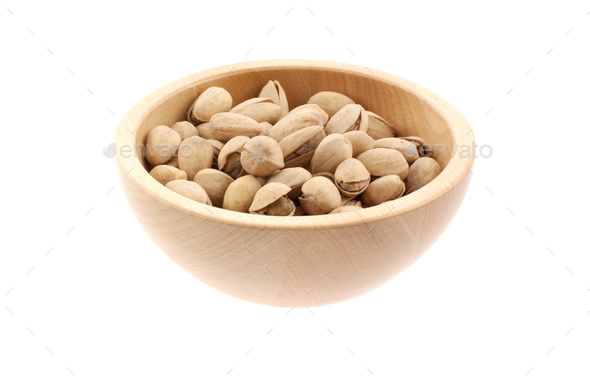 pistachios in a wood bowl - Stock Photo - Images